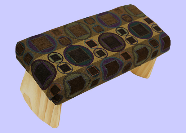 meditation bench with brown, gold and green circles and squares